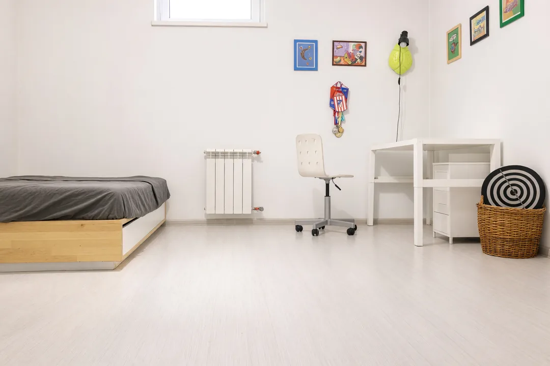 Kids’ bedroom – After · AI-edited: drawings, ball and boxes removed, furniture kept
